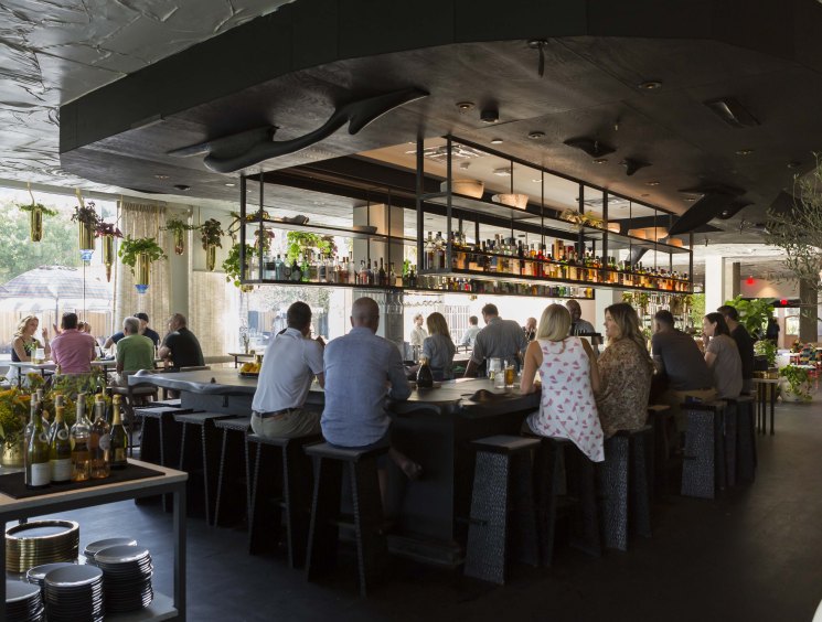 Modern bar and restaurant interior at The Line Austin hotel with mid-century design elements and contemporary furnishings