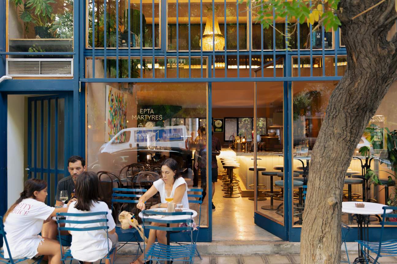 Diners sitting at the front of Epta Martyres in Athens.