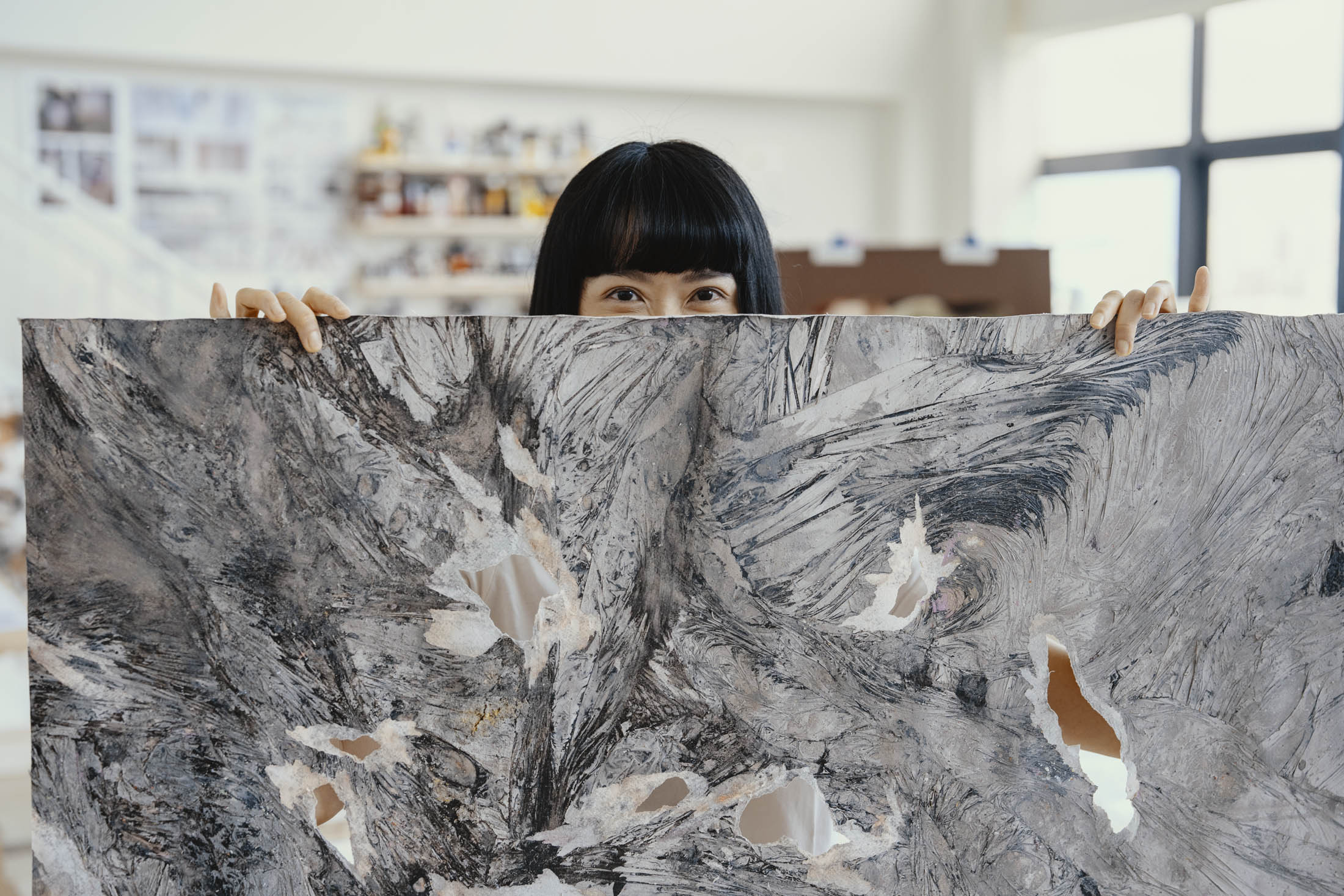 Dawn Ng with one of her paintings.