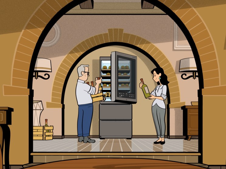 A couple filling a wine cellar in the kitchen