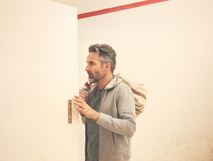 Ben wears hooded top by Sunspel, t-shirt by Oliver Spencer, bag by Polo Ralph Lauren