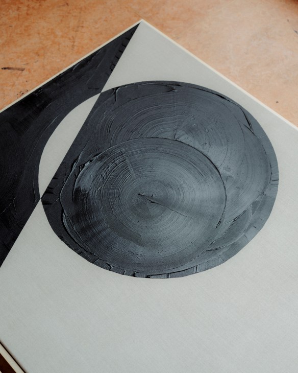 Tabitha Millett's black and white abstract geometric painting with circular forms and textural brushwork