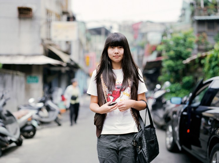 Student Zu Pei-Shar, 17, walking near Humin market