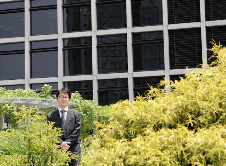 Yoriyuki Yamada among the green landscaping of Kajima’s office in Tokyo