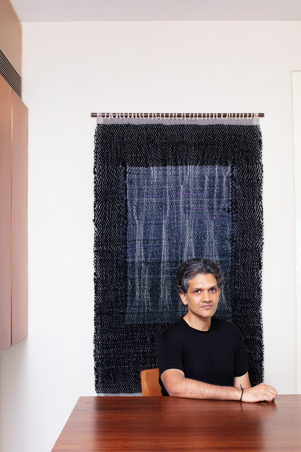 Art collector Udit Bhambri in his Mumbai home surrounded by South Asian contemporary artworks