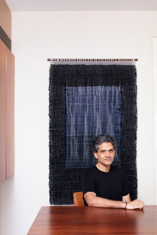 Art collector Udit Bhambri in his Mumbai home surrounded by South Asian contemporary artworks