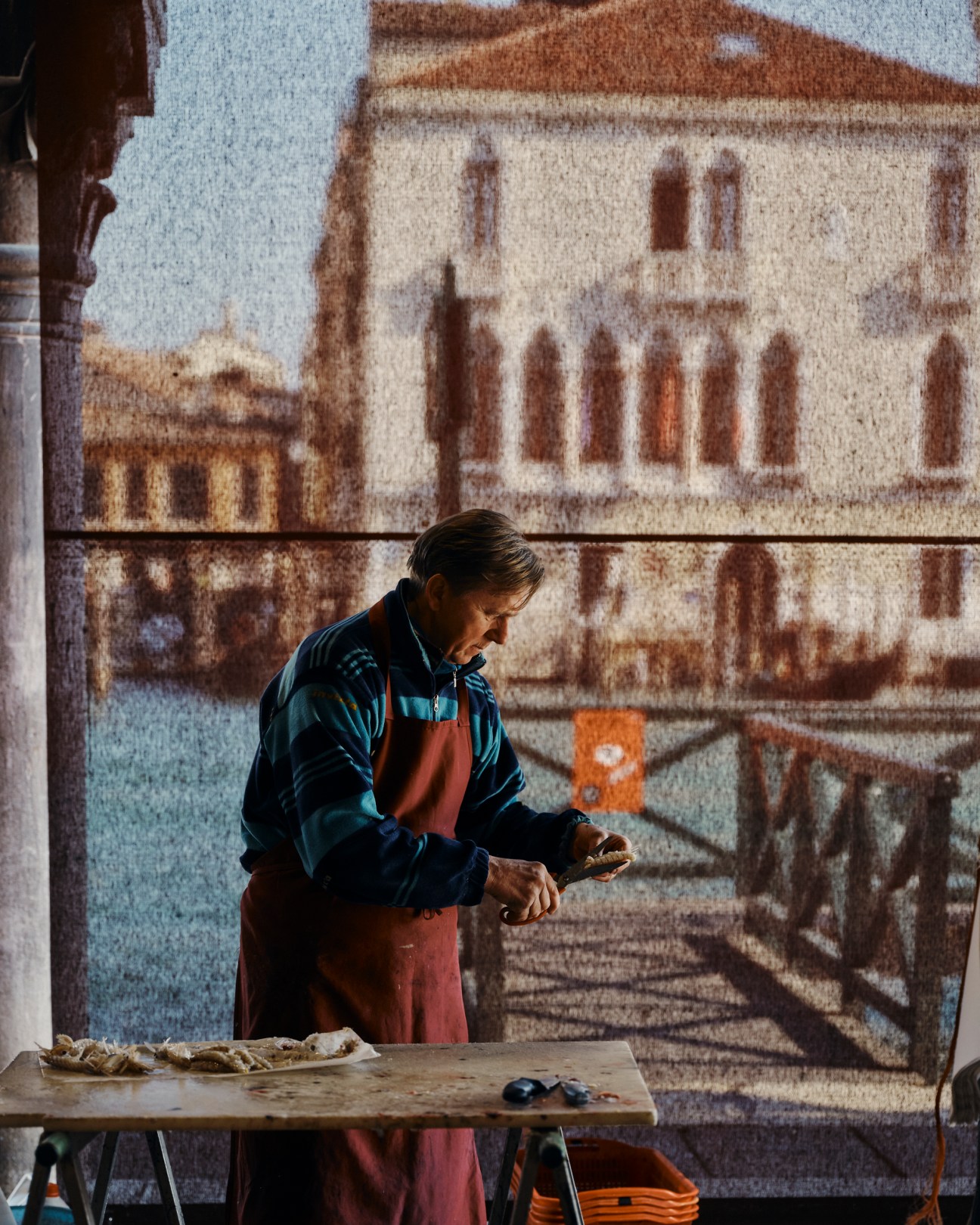 Restaurant staff catching produce tossed from delivery boats