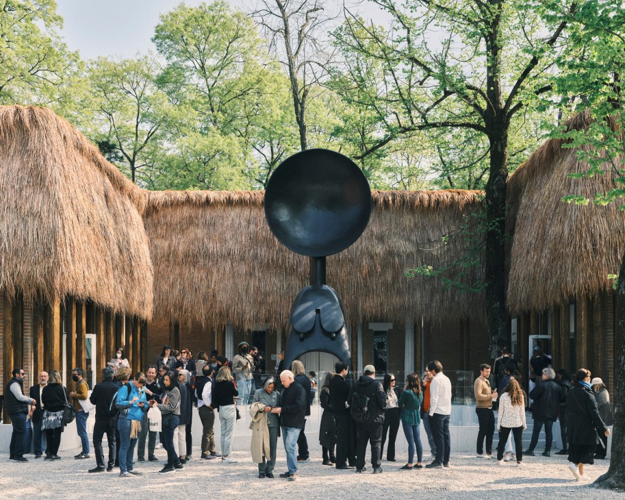 Crowds gathering outside the thatched-roof US Pavilion at Venice Biennale