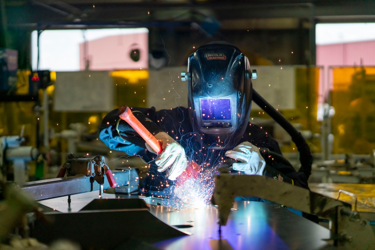 Workers and machinery at Vermeer's Iowa manufacturing facility