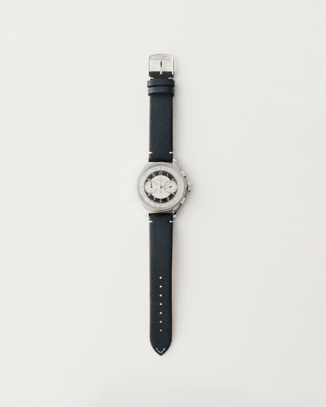 Longines Heritage Classic Tuxedo watch with white dial and black leather strap