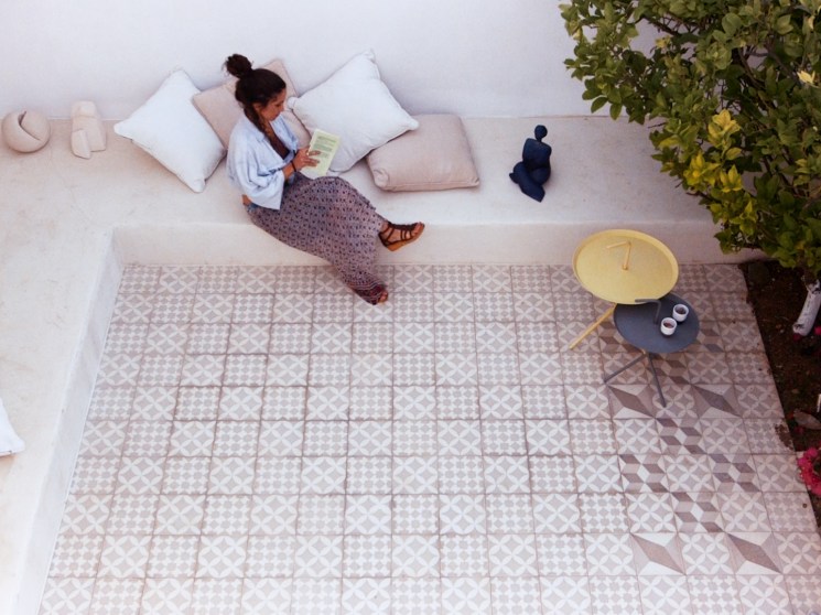 Architect reading in courtyard