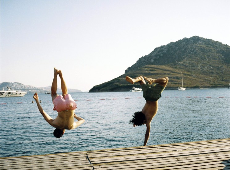Young Turkish guys jumping in the sea