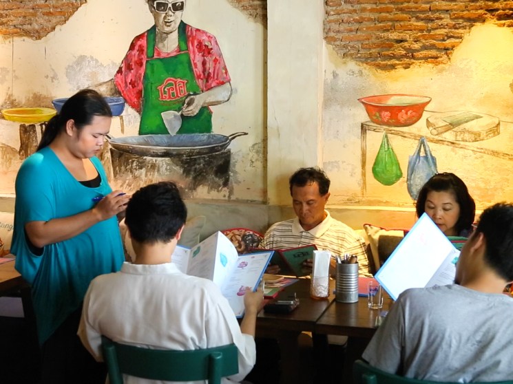 People at a restaurant in Bangkok.