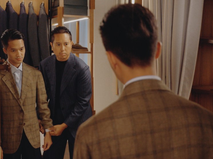 A customer trying on a jacket