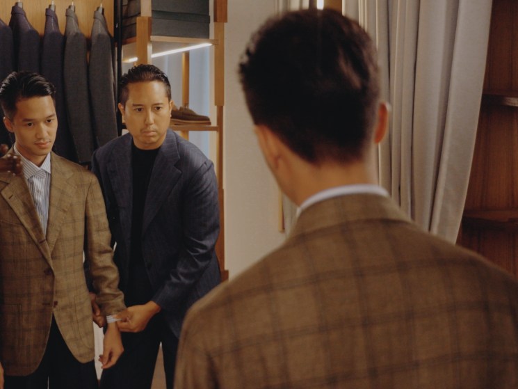 A customer trying on a jacket