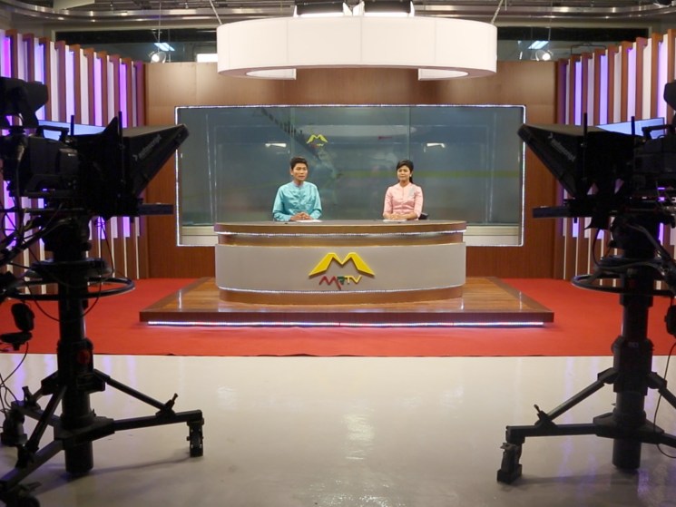 Presenters in a TV studio in Burma.