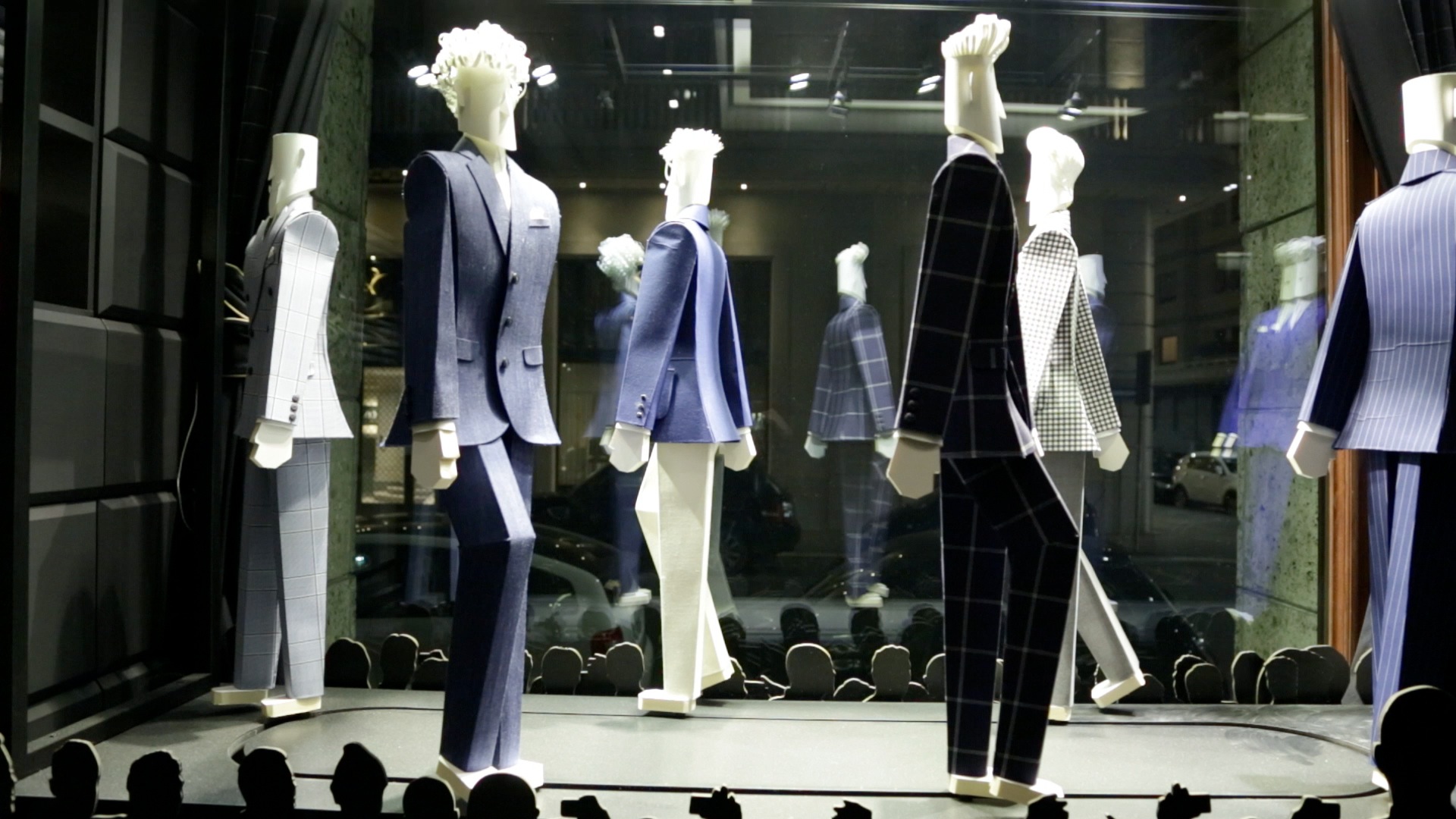 Window display with figurines.