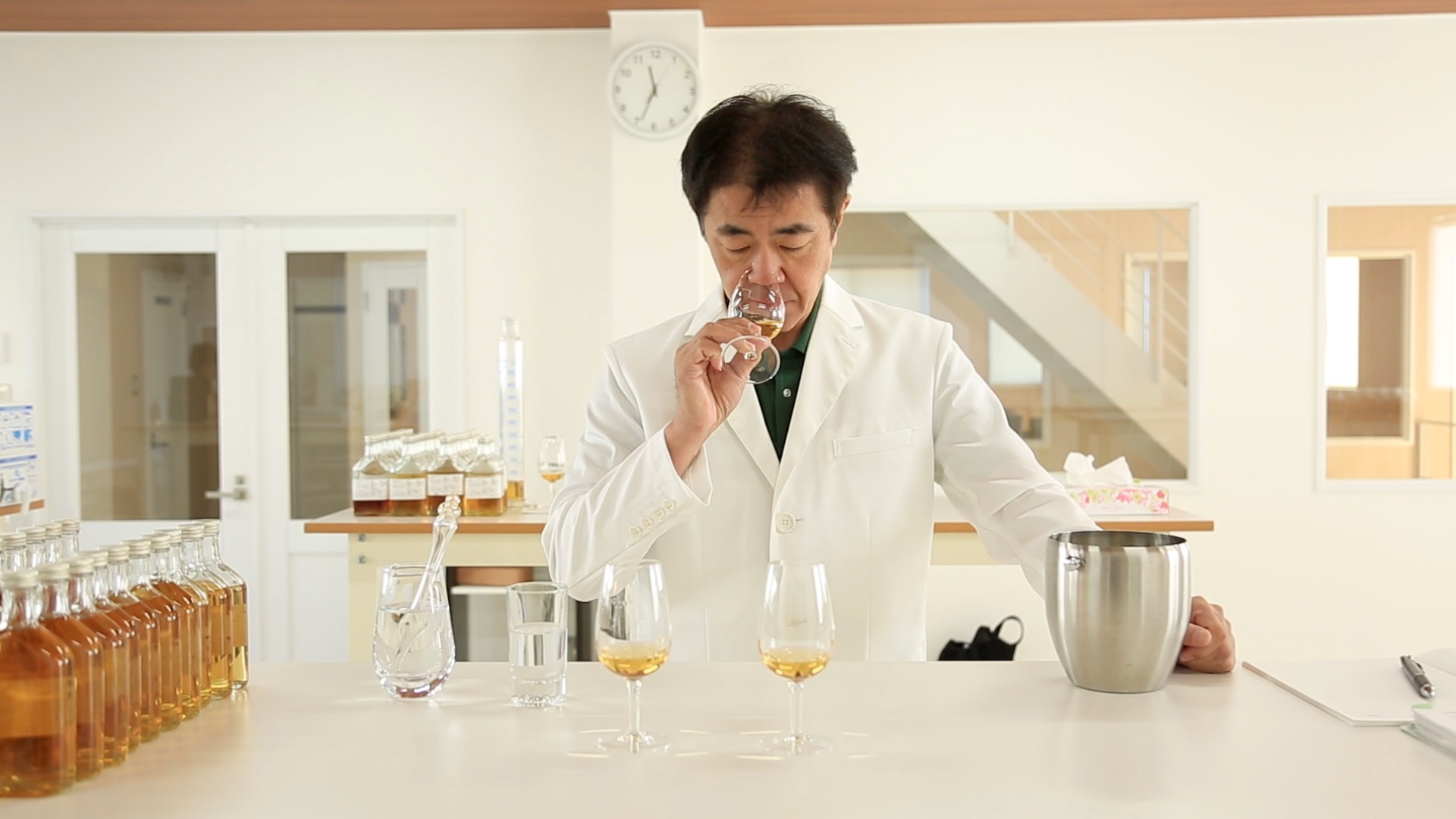 Master distiller tasting whiskey.