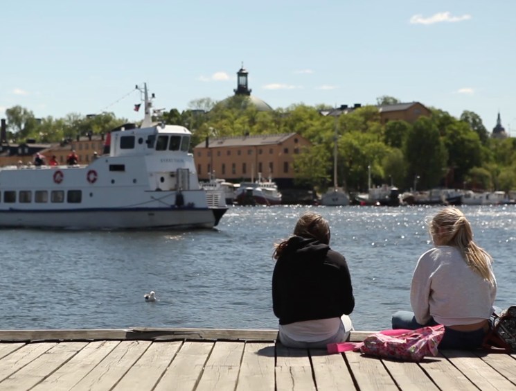 Two girls relaxing by the Stockholm waterfront