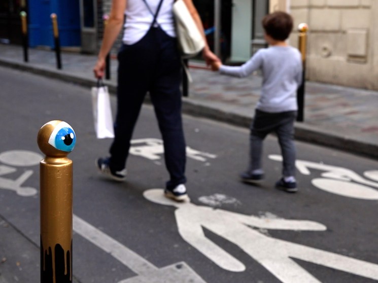 Mother and son walking in a street