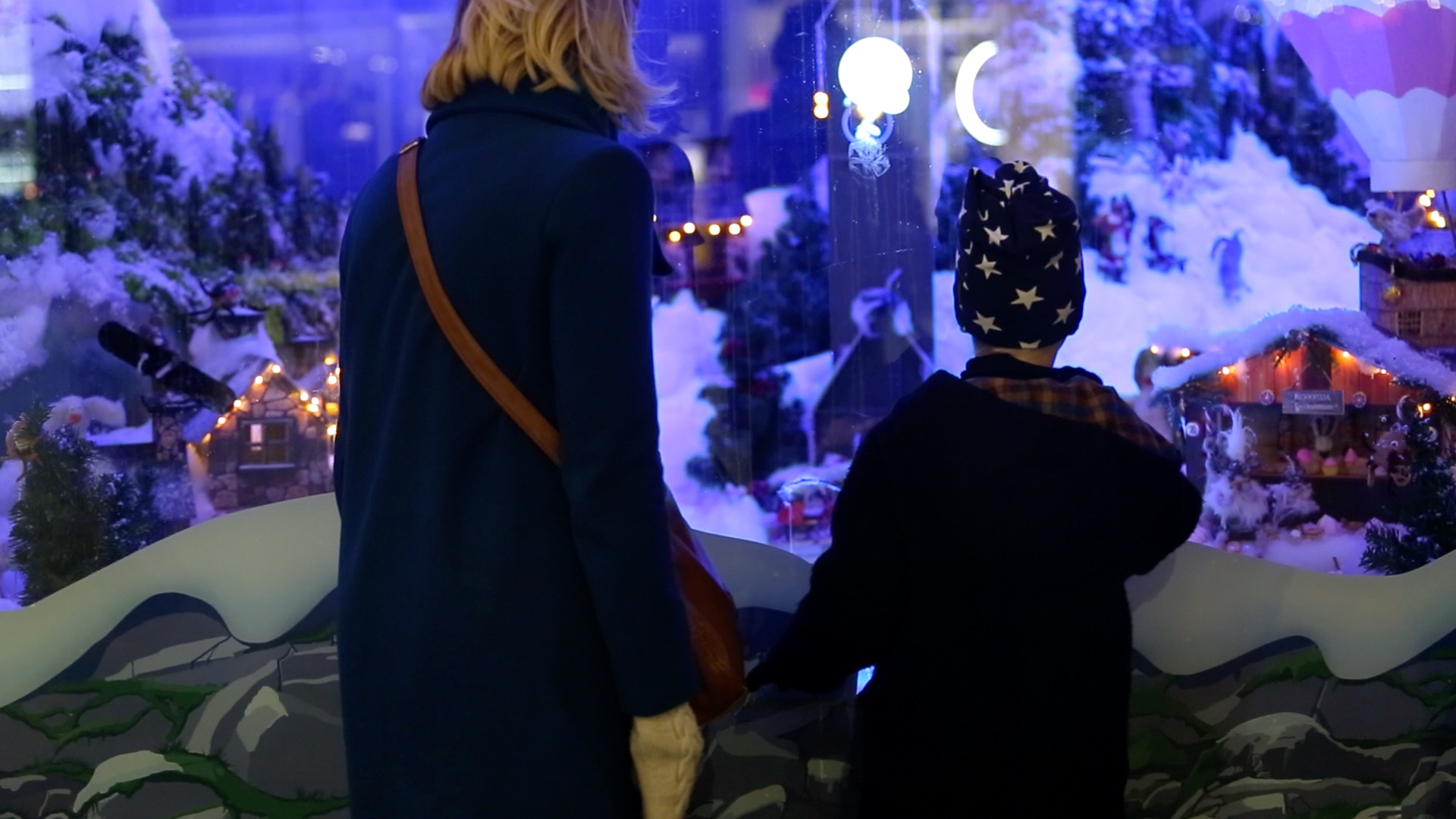 Boy and mother in front of Stockman's Christmas window in Helsinki