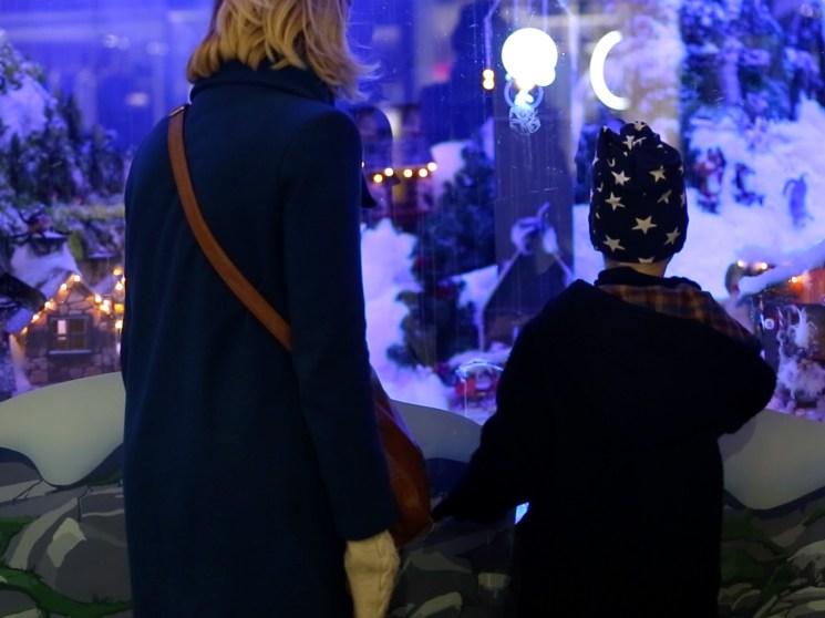 Boy and mother in front of Stockman's Christmas window in Helsinki