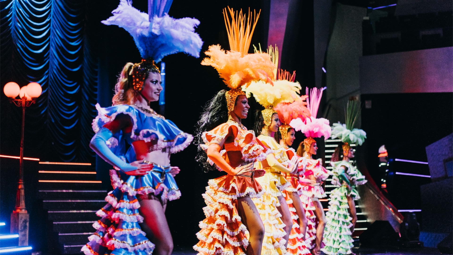 Performers on the stage of a cruise ship.