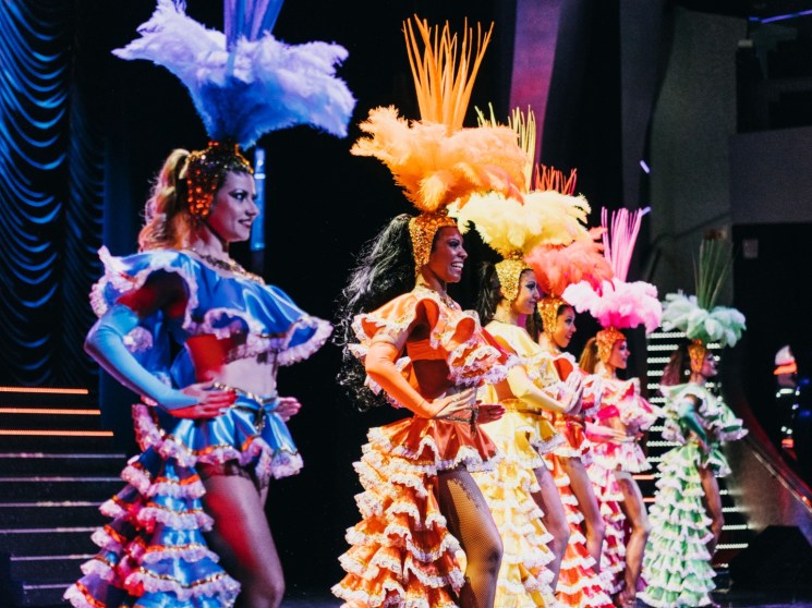 Performers on the stage of a cruise ship.