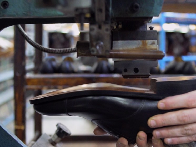 A shoe being made by hand.