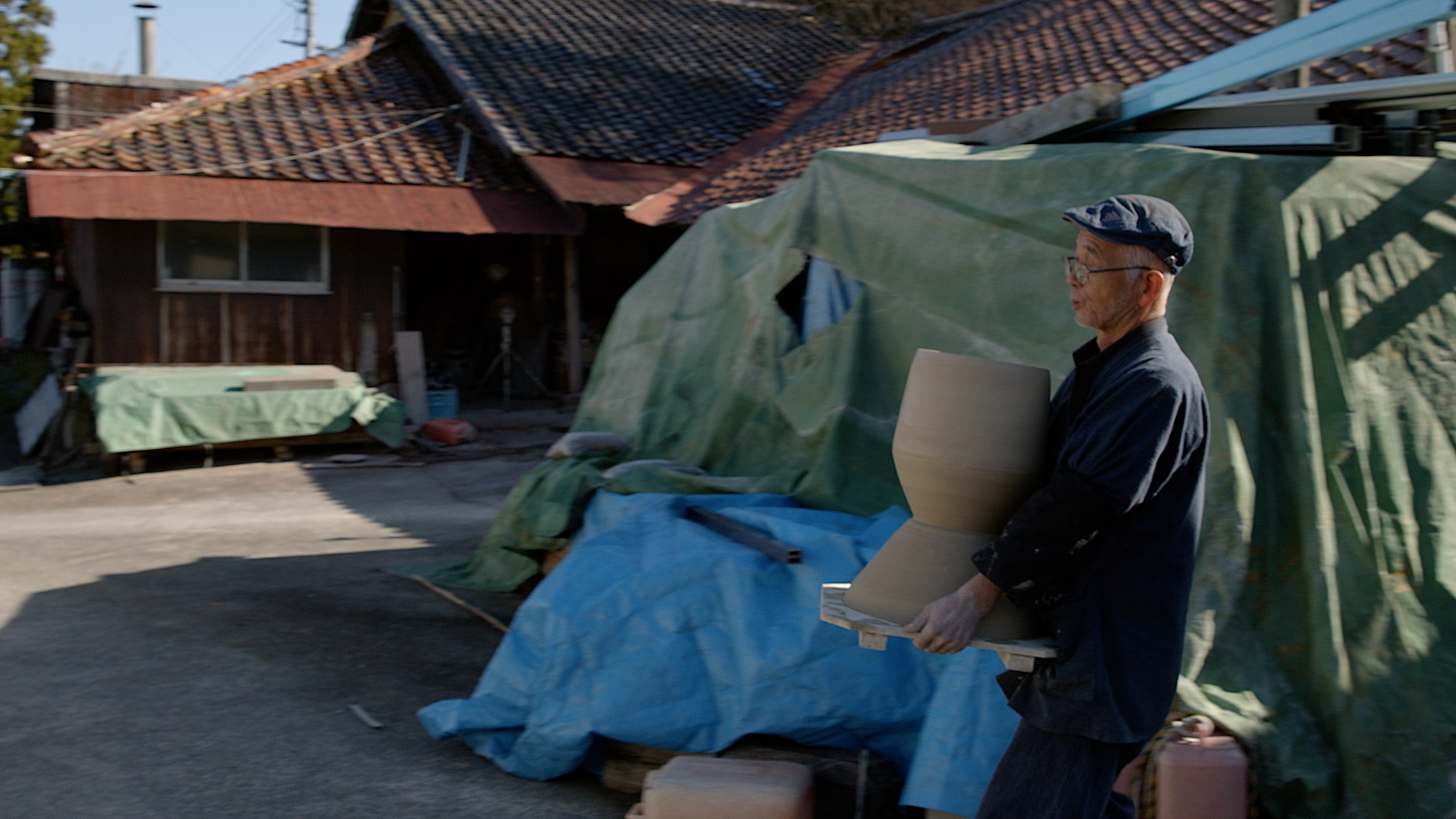 Craftsman carrying a sculpture