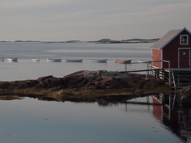 hut and boats on seashore