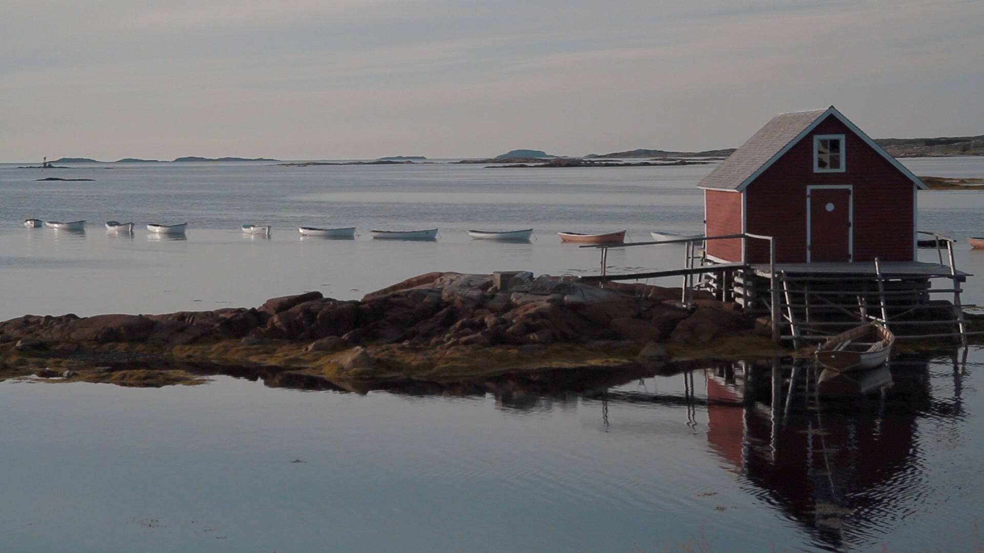 hut and boats on seashore