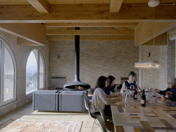 A family having lunch with wine.