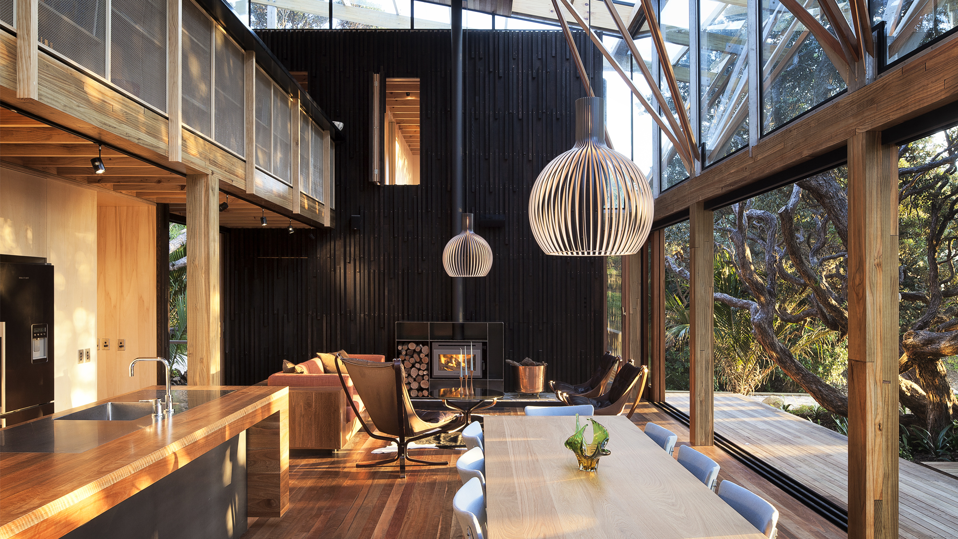 A wooden interior with a fireplace.