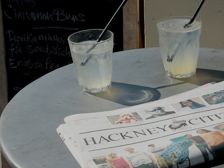 newspaper and drinks on a table