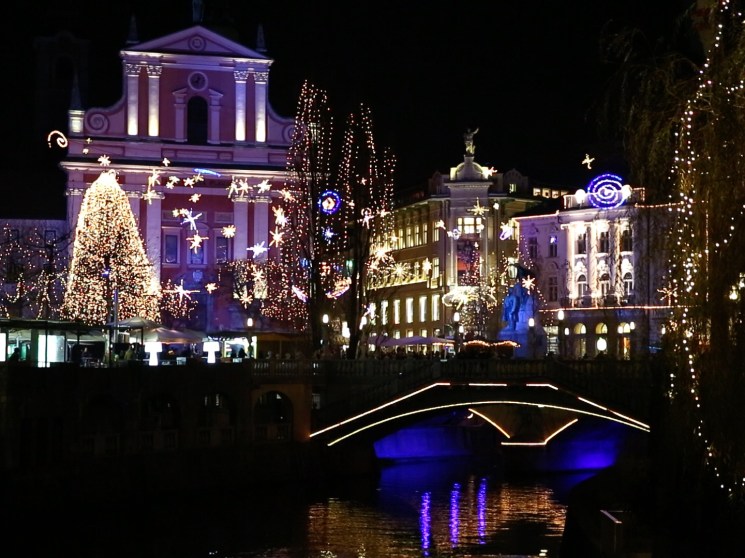 A street in Ljubljana lit up with Christmas decorations.