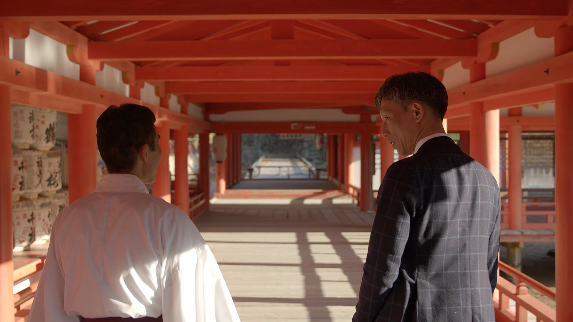 People walking in the Itsukushima shrine.