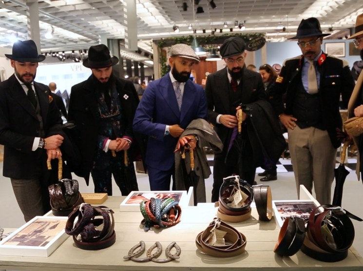 Men looking at the display at Pitti Uomo.