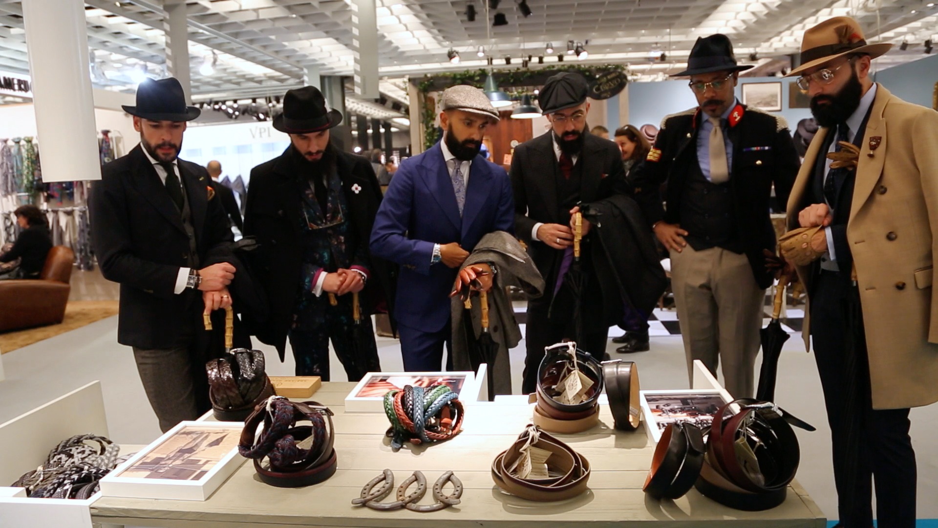 Men looking at the display at Pitti Uomo.