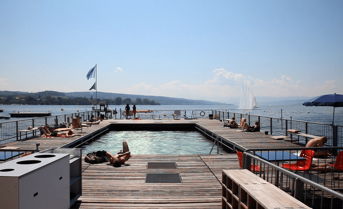 people by swimming pool and lake