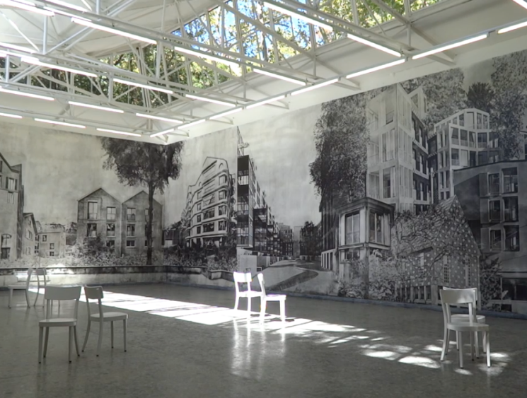 exhibition room with chairs and graffiti