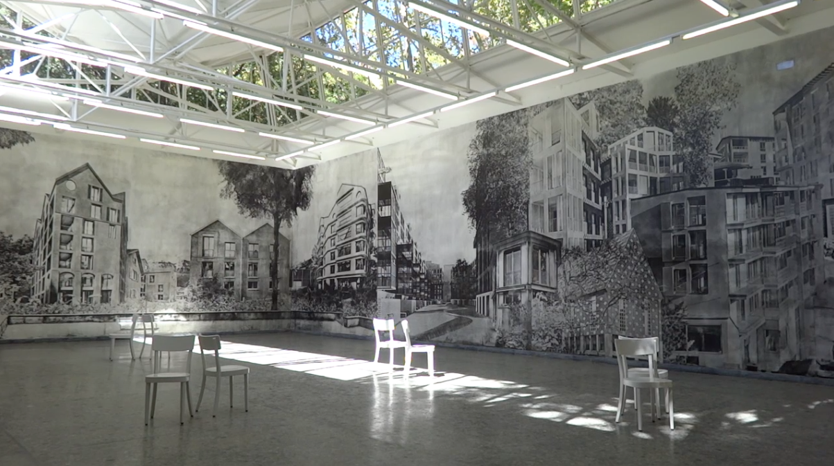 exhibition room with chairs and graffiti