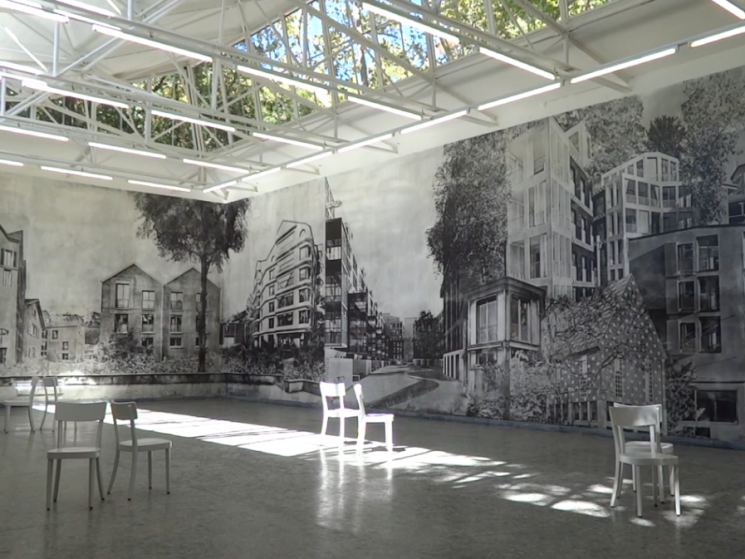 exhibition room with chairs and graffiti