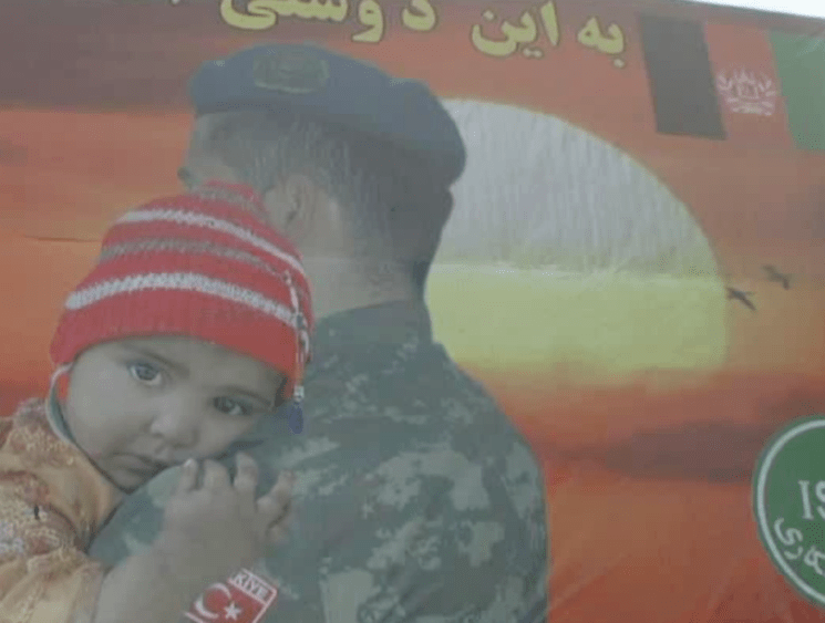 soldier hugging child