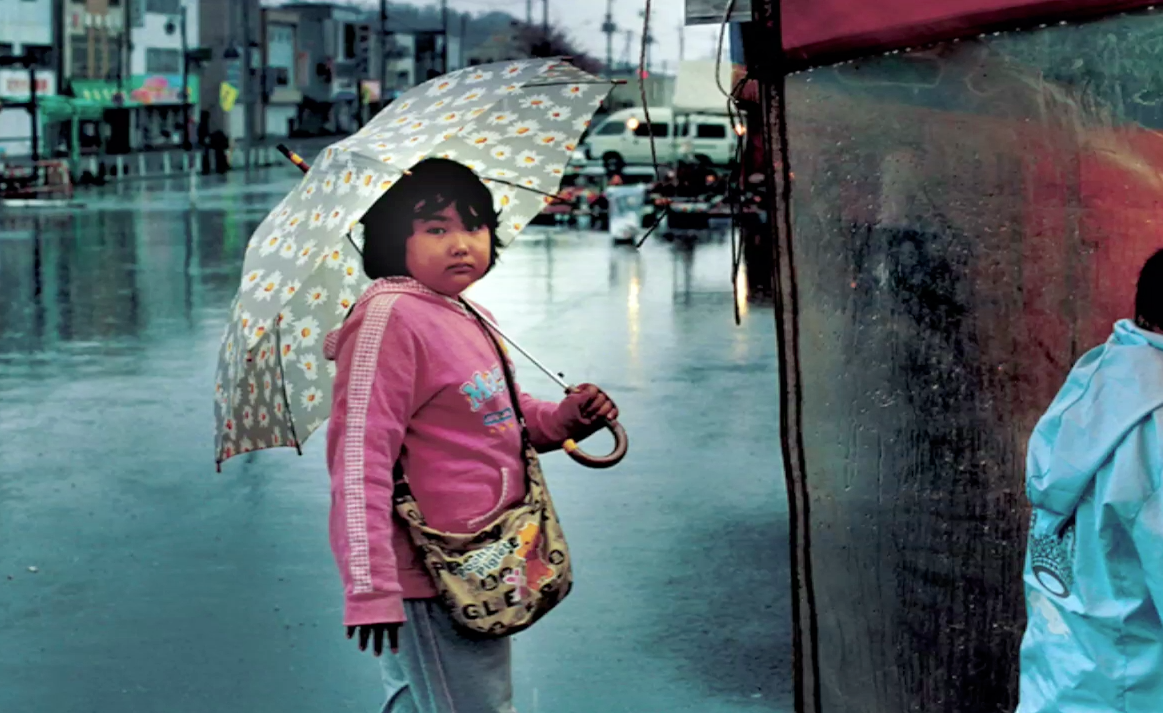 child with umbrella