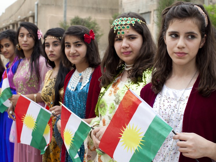 Kurdish women with flags