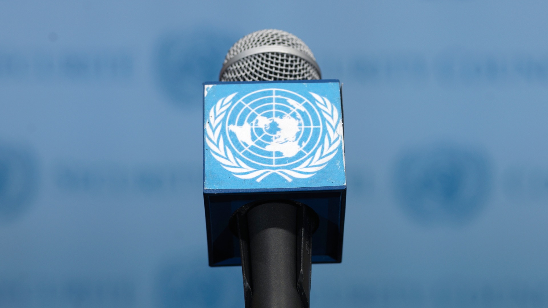 A microphone with a logo of the United Nations.