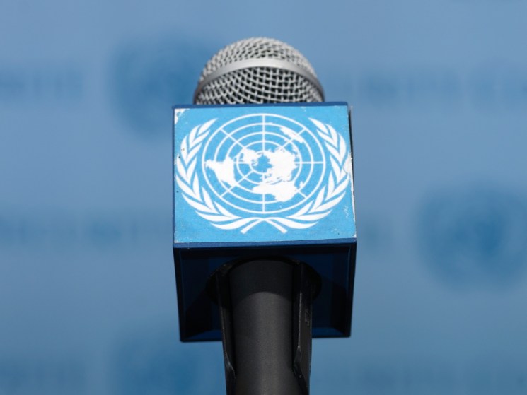 A microphone with a logo of the United Nations.