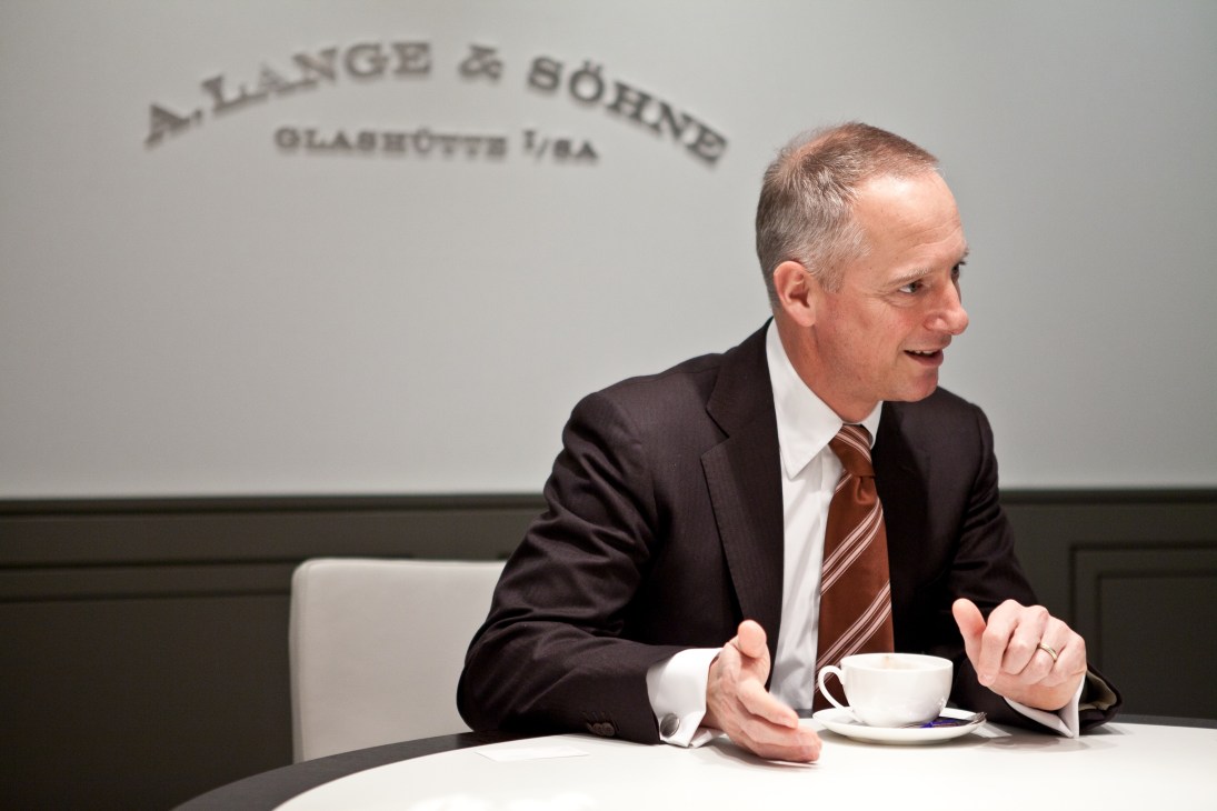 Wilhelm Schmid, CEO of A Lange & Söhne, speaking at a table with A Lange & Söhne signage behind him.