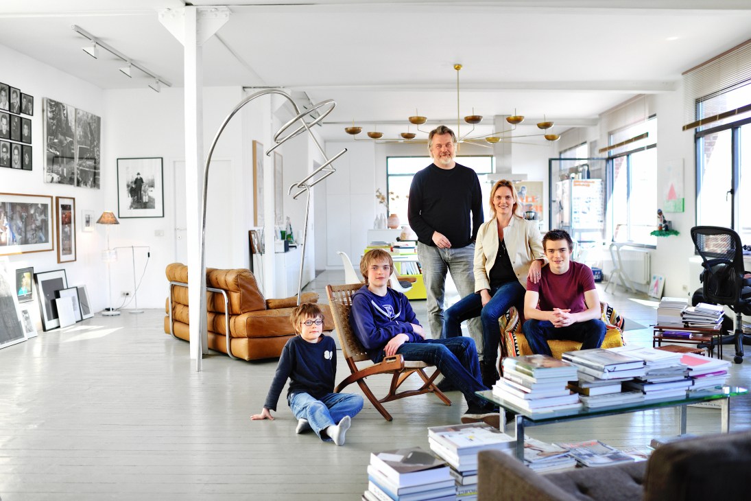 Dimitri Jeurissen, head of Base Design, poses with his family in their bright, modern Saint-Gilles loft.
